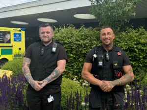 Lee Taylor Head of Security and Portering and colleague stood outside A&E at Gateshead.